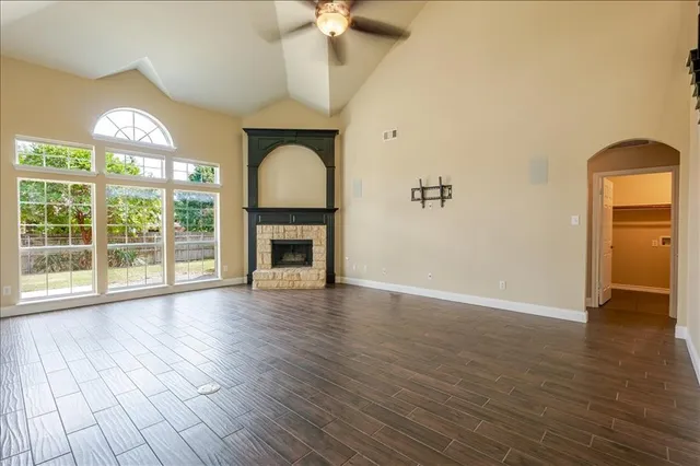 a view of a hallway view with wooden floor and staircase