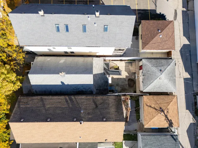 an aerial view of residential houses with outdoor space
