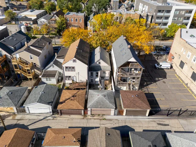 an aerial view of a house with outdoor space