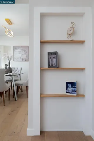 a kitchen with a sink window and cabinets