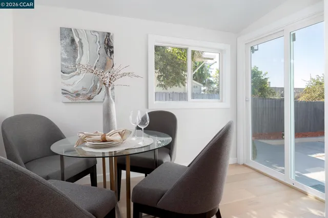 a bedroom with a bed and a potted plant