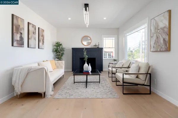 a living room with furniture a window and a fireplace