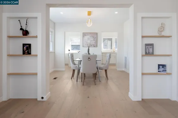 a view of a dining room with furniture and wooden floor