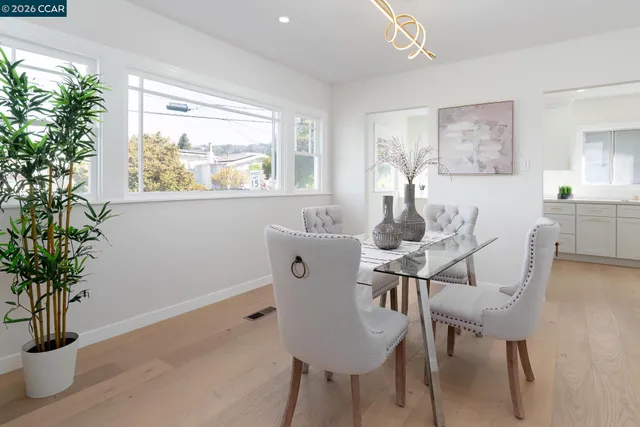 a view of a dining room with furniture window and outside view