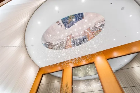 a living room with furniture and a lamp