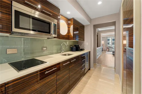 a kitchen with a sink and cabinets
