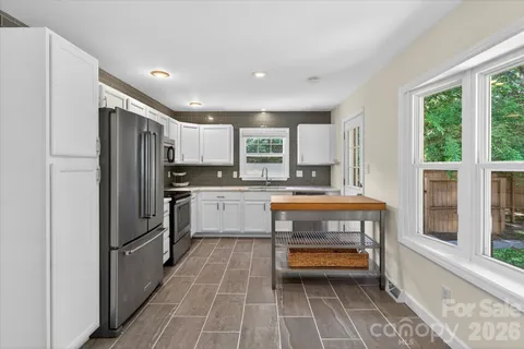 a kitchen with counter top space and stainless steel appliances