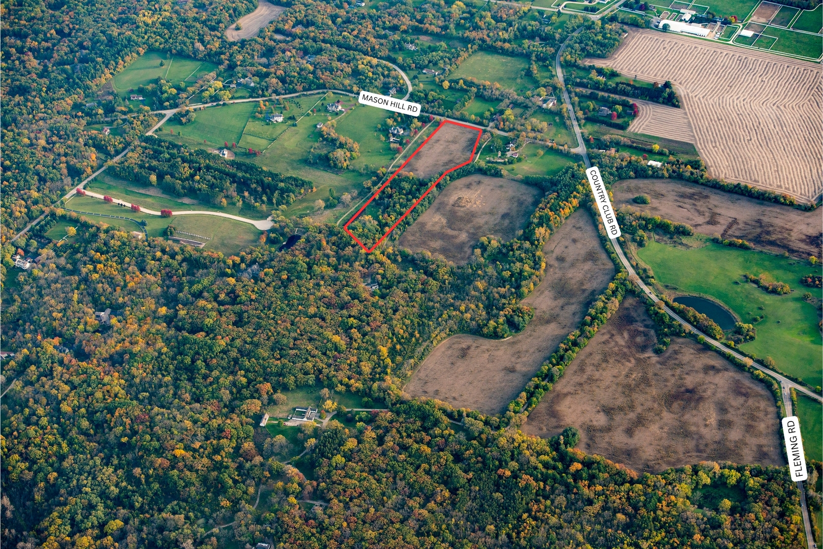 Lt 2 Mason Hill Road Woodstock, IL 60098 - Photo 2 of 2 an aerial view of a house with a yard and large trees