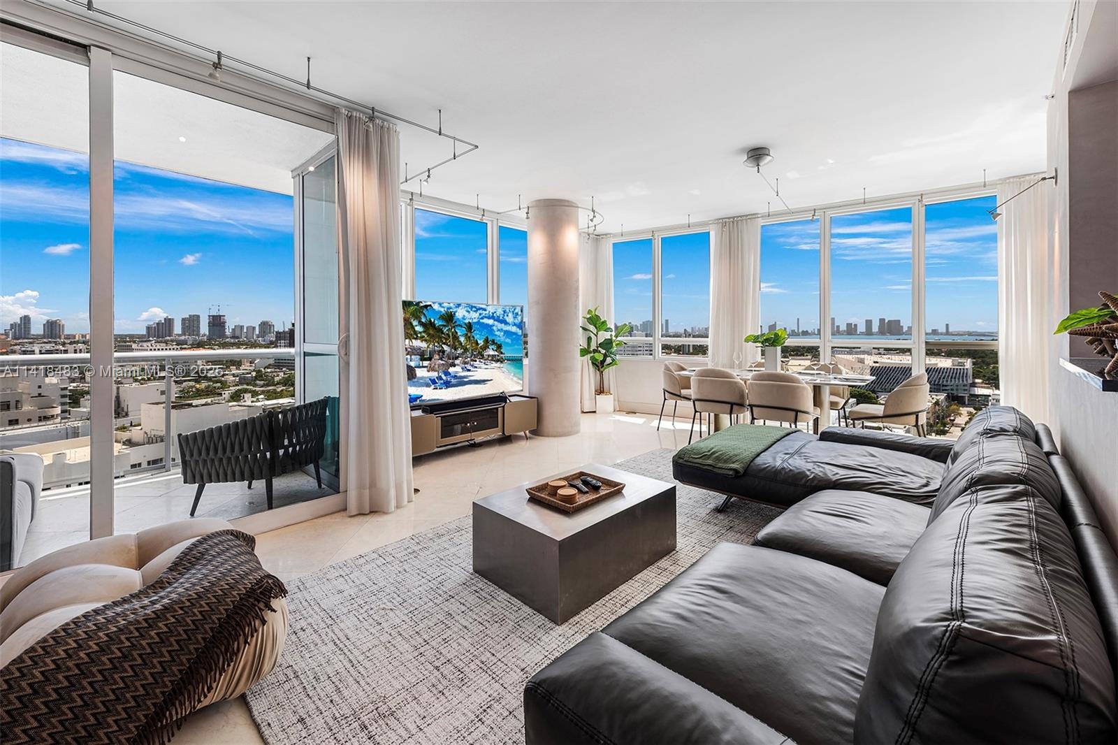 101 20th Street, Unit 2102 Miami Beach, FL 33139 - Photo 1 of 40 a living room with furniture ceiling fan and a rug