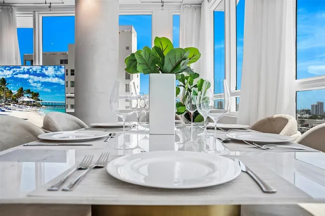 a dining room with furniture window and wooden floor