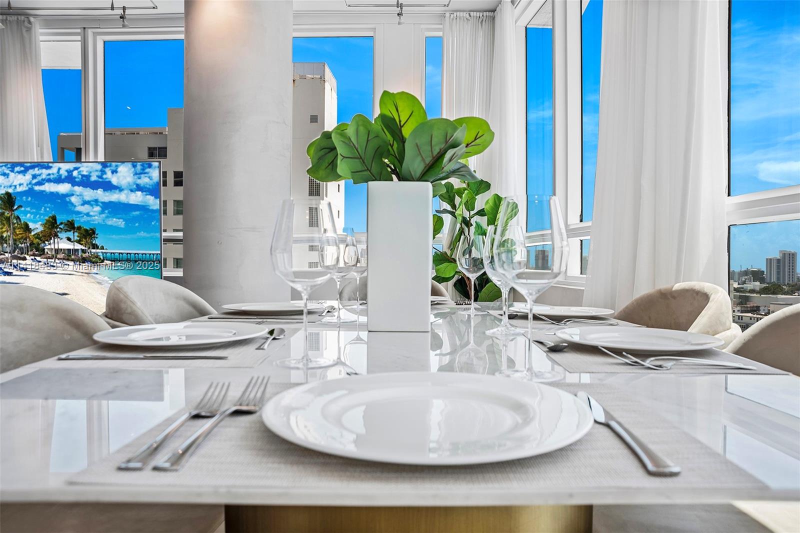101 20th Street, Unit 2102 Miami Beach, FL 33139 - Photo 13 of 40 a dining room with furniture window and wooden floor