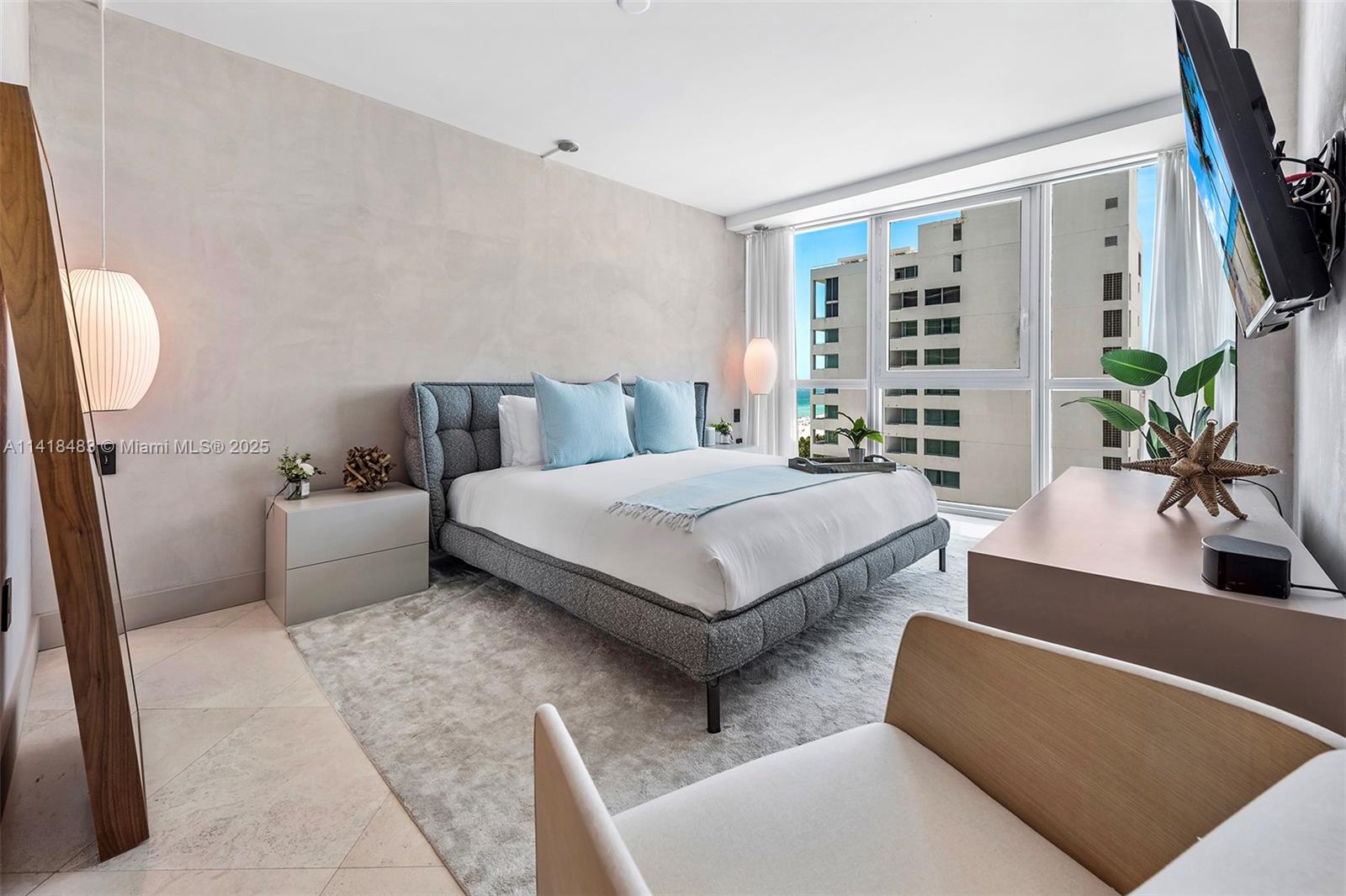 101 20th Street, Unit 2102 Miami Beach, FL 33139 - Photo 20 of 40 a living room with furniture and a potted plant