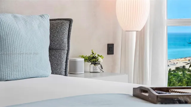 a white tub sitting next to a window