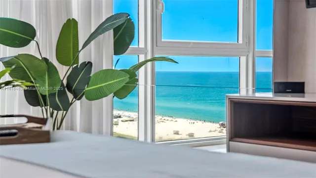 a closeup of a window with a potted plant