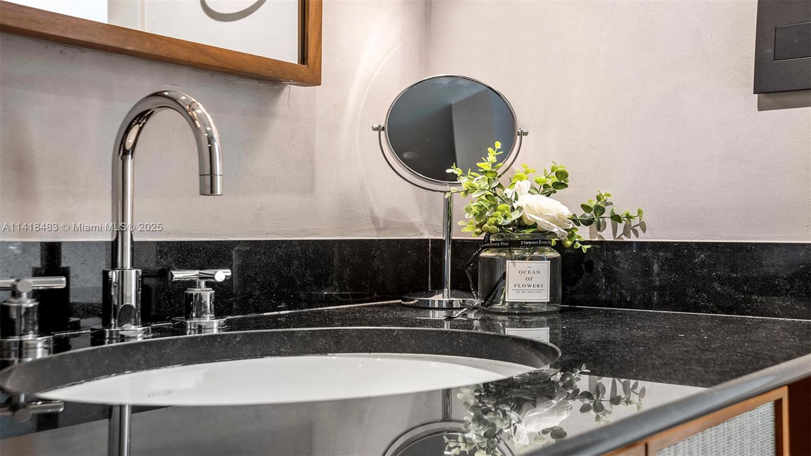 101 20th Street, Unit 2102 Miami Beach, FL 33139 - Photo 28 of 40 a bathroom with a sink and a mirror