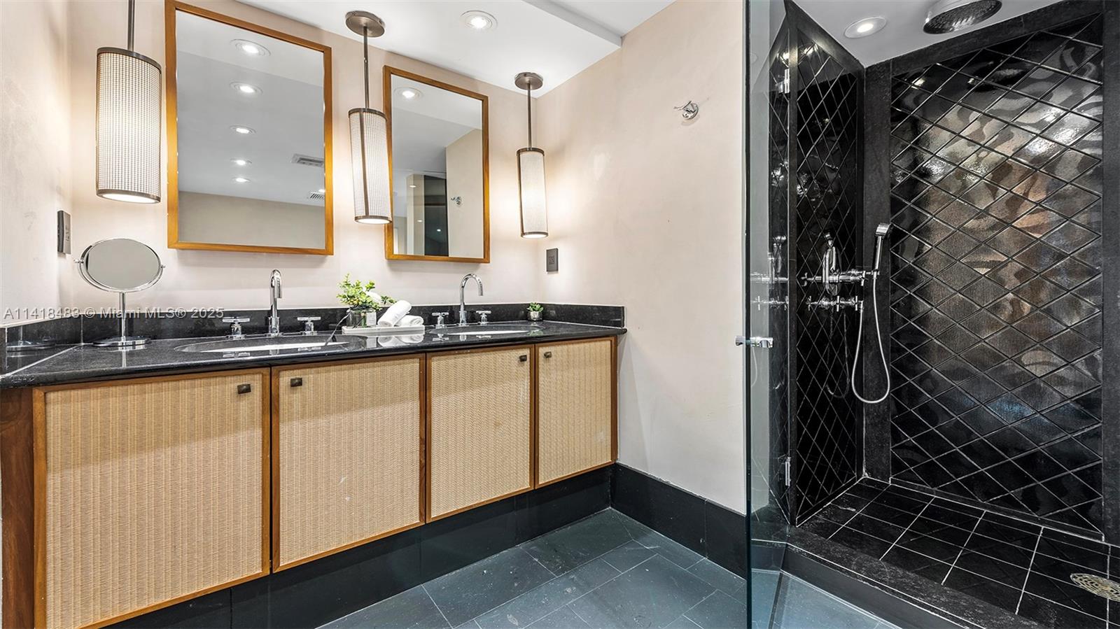 101 20th Street, Unit 2102 Miami Beach, FL 33139 - Photo 29 of 40 a bathroom with a sink and a mirror