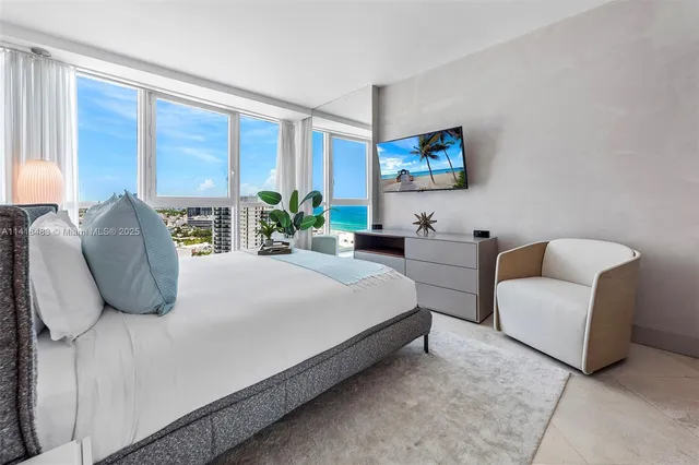 a bedroom with bed and a couch