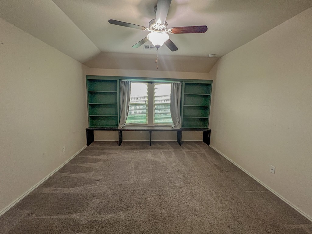324 Druse Lane Jarrell, TX 76537 - Photo 20 of 29 an empty room with windows and ceiling fan