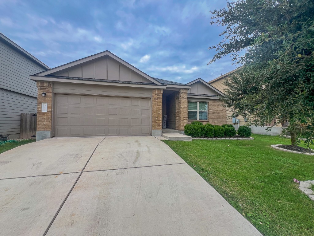 324 Druse Lane Jarrell, TX 76537 - Photo 2 of 29 a front view of house with yard and green space