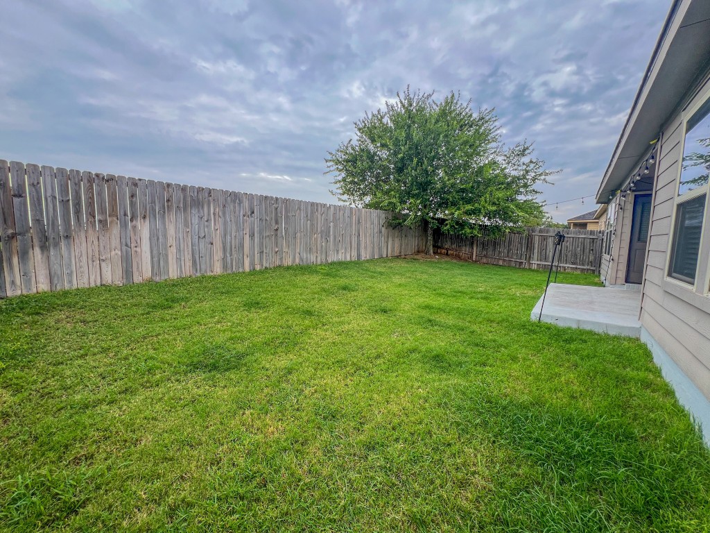 324 Druse Lane Jarrell, TX 76537 - Photo 27 of 29 a view of a backyard with a garden