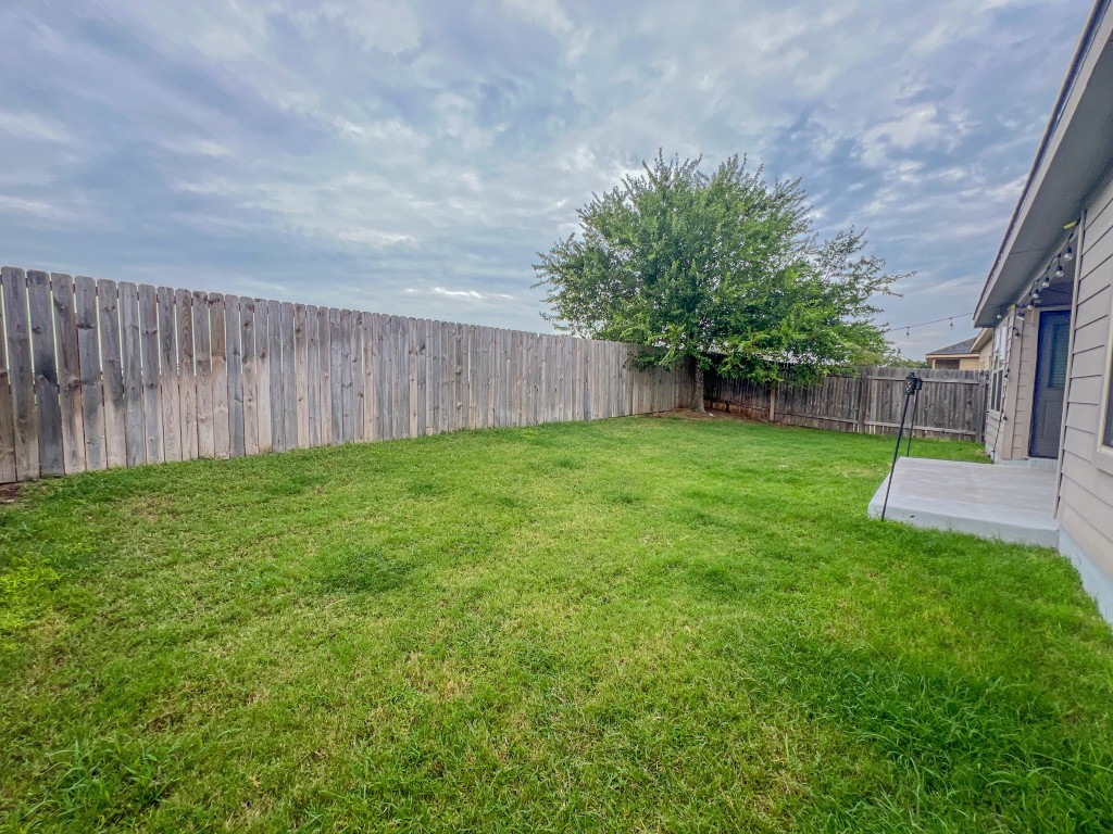 324 Druse Lane Jarrell, TX 76537 - Photo 28 of 29 a view of a backyard with a garden