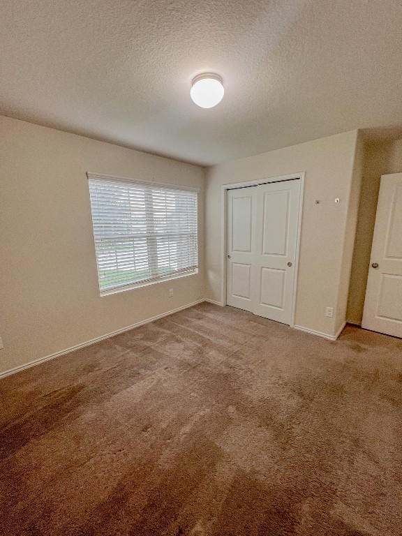 324 Druse Lane Jarrell, TX 76537 - Photo 7 of 29 an empty room with a empty space and windows