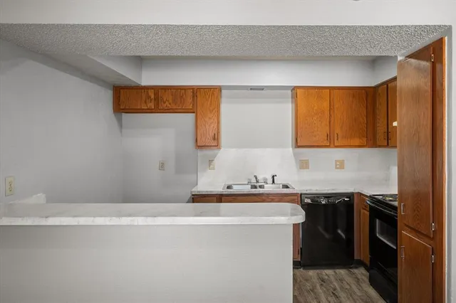a kitchen with a sink and cabinets