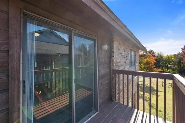 a view of a door and wooden floor