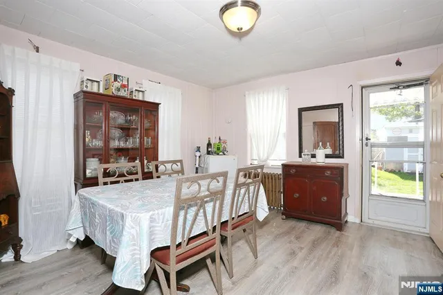 a view of a dining room with furniture and window