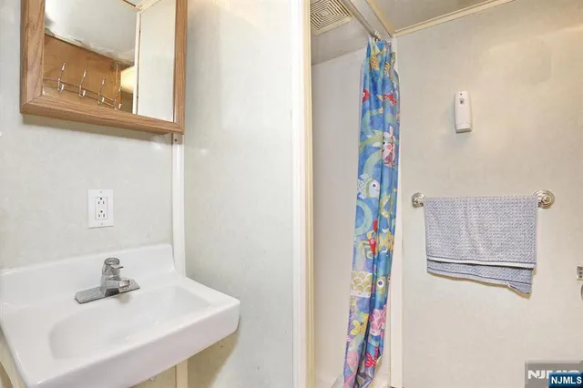 a bathroom with a sink and a mirror