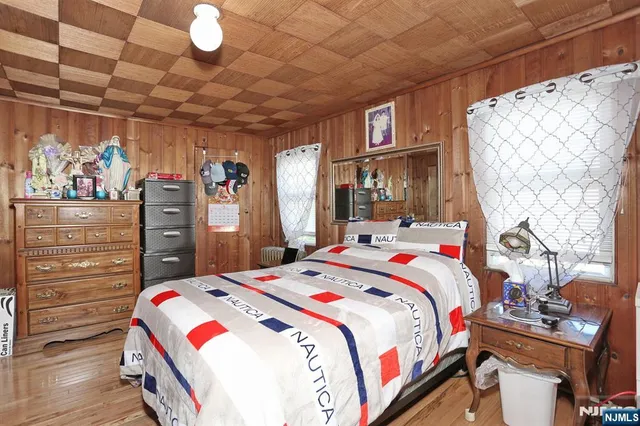 a bed room with a bed and a tv