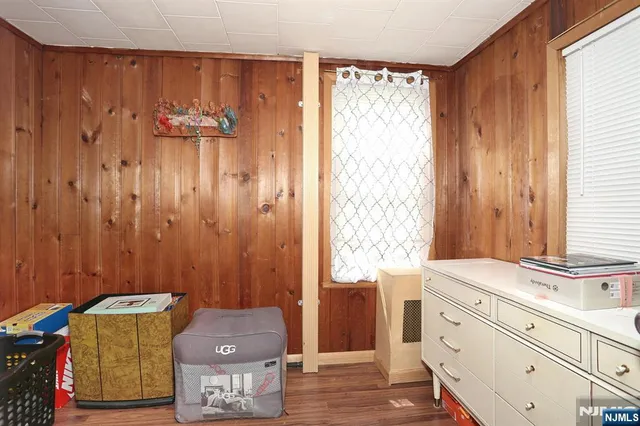 a room with a window and a mirror