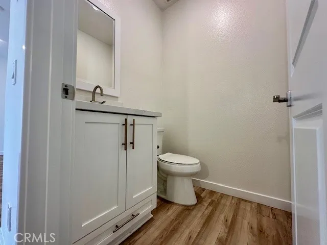 a bathroom with a toilet and a mirror