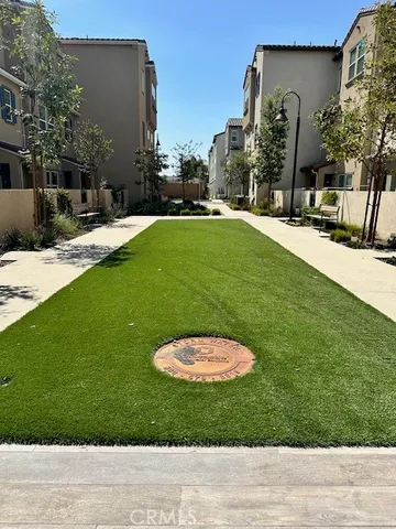 a swimming pool with outdoor seating and yard
