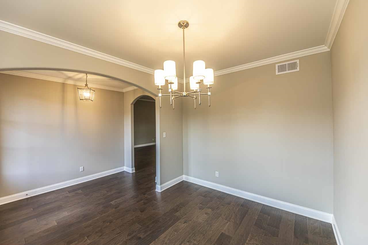 115 Misty Rdg Loop Oakland, TN 38060 - Photo 10 of 29 wooden floor in an empty room with a window