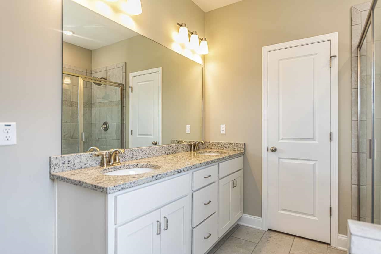 115 Misty Rdg Loop Oakland, TN 38060 - Photo 17 of 29 a bathroom with a double vanity sink and a mirror