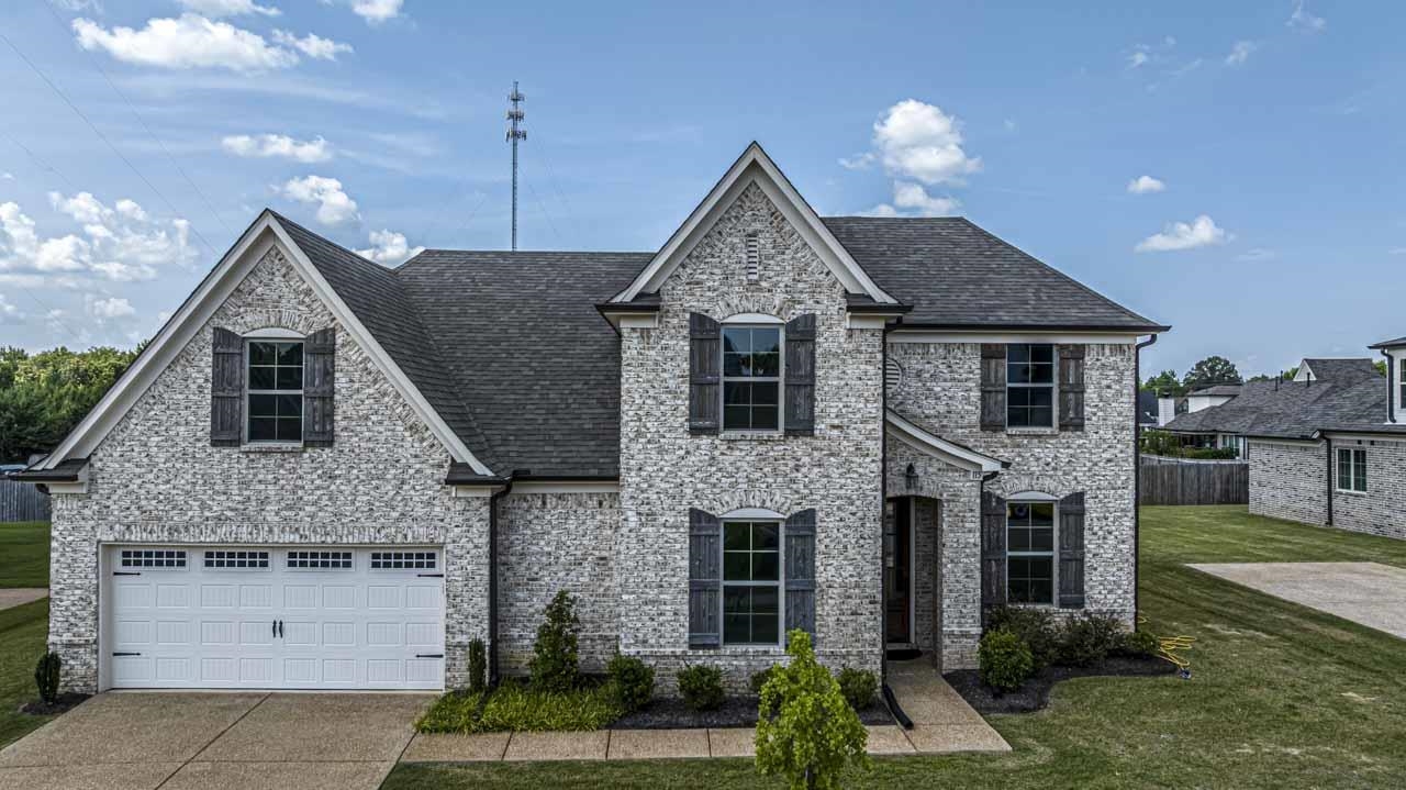 115 Misty Rdg Loop Oakland, TN 38060 - Photo 2 of 29 a front view of a house with a garden