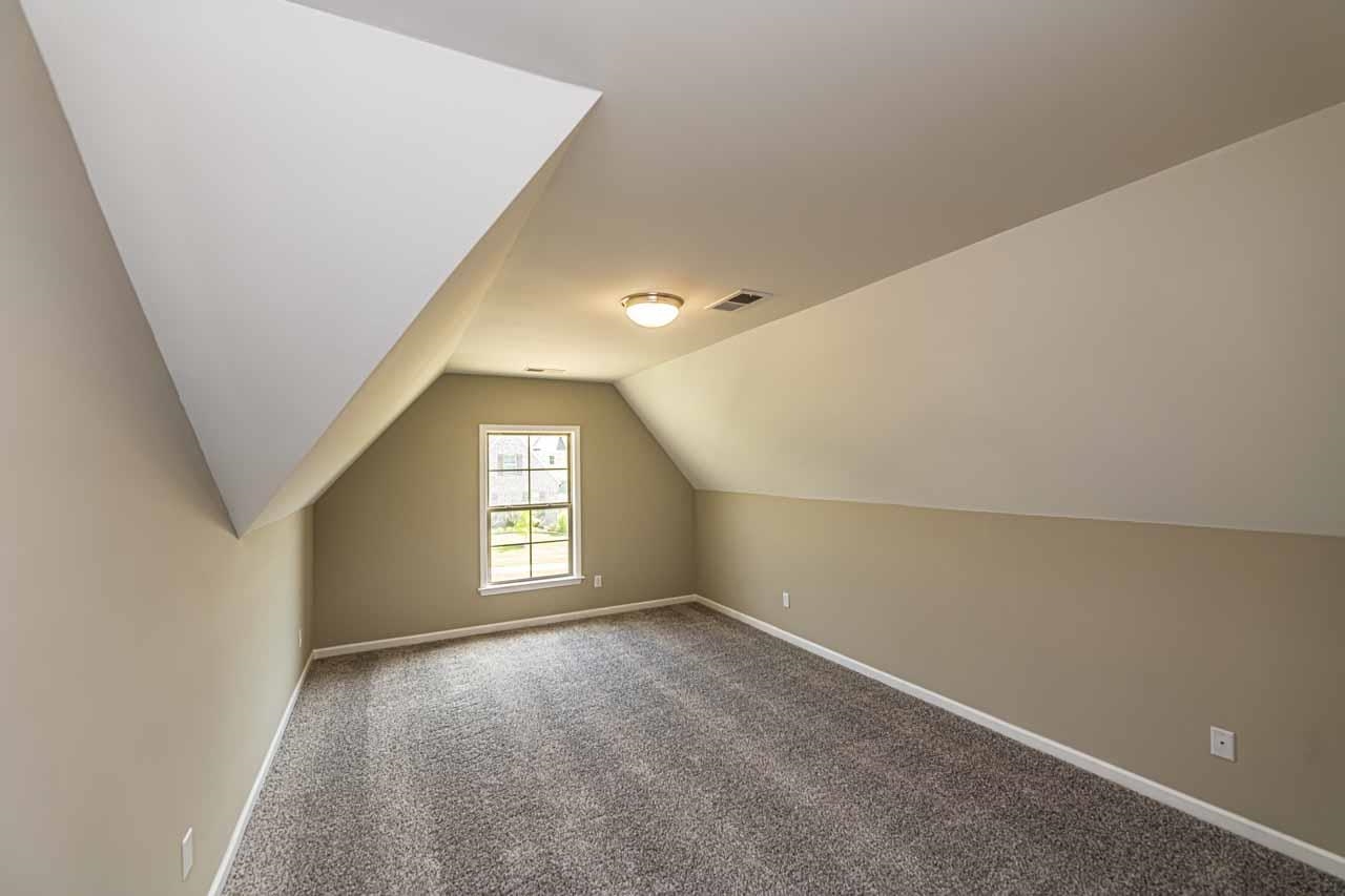 115 Misty Rdg Loop Oakland, TN 38060 - Photo 22 of 29 an empty room with windows and closet in a room