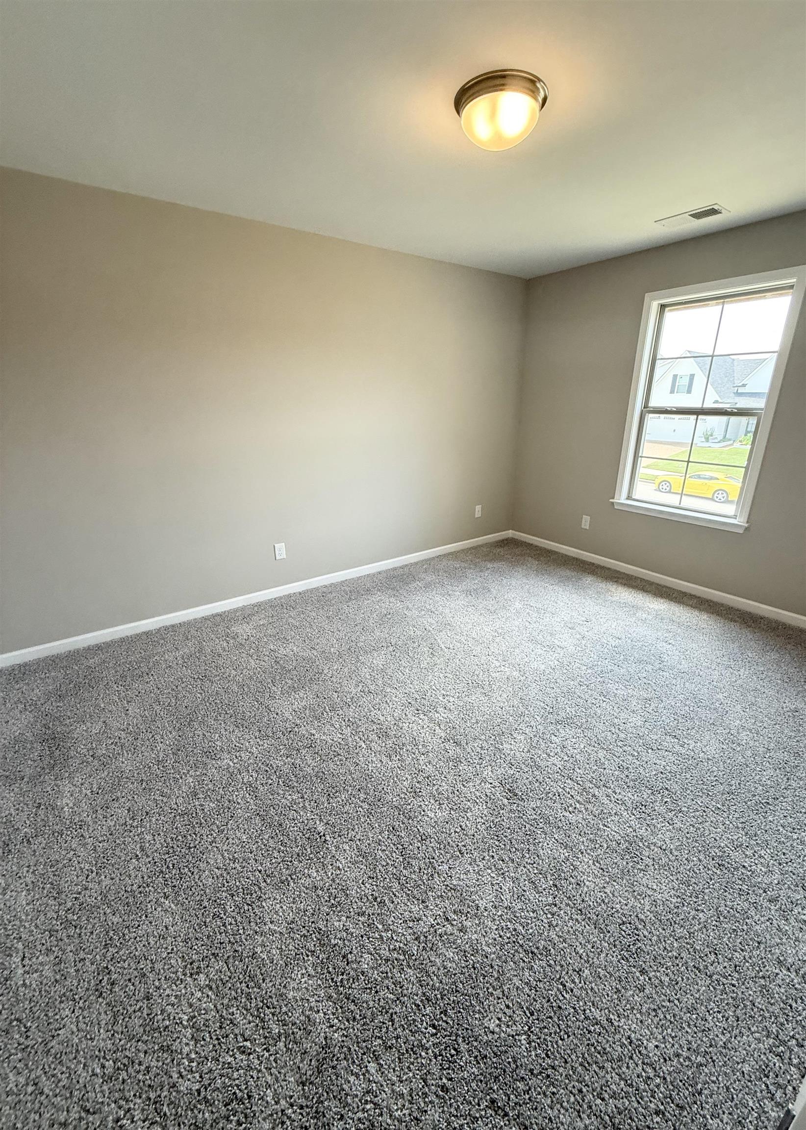 115 Misty Rdg Loop Oakland, TN 38060 - Photo 24 of 29 an empty room with windows and entrance