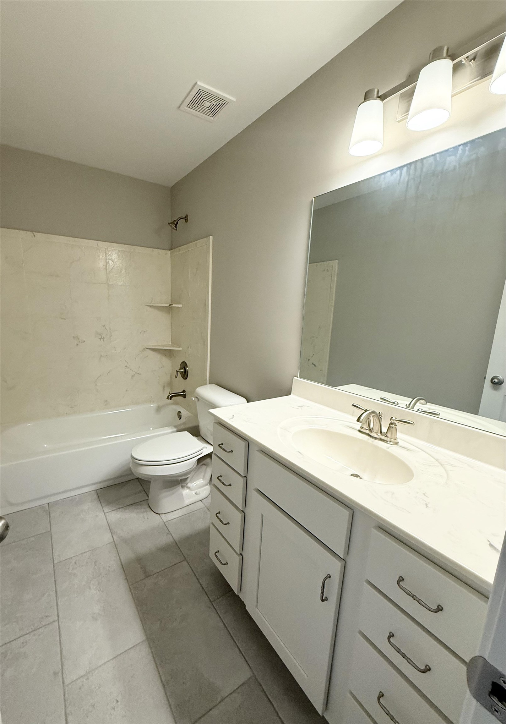 115 Misty Rdg Loop Oakland, TN 38060 - Photo 25 of 29 a bathroom with a double vanity sink and a bathtub