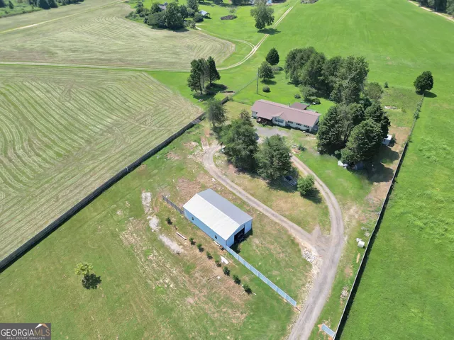 a view of a swimming pool with a yard