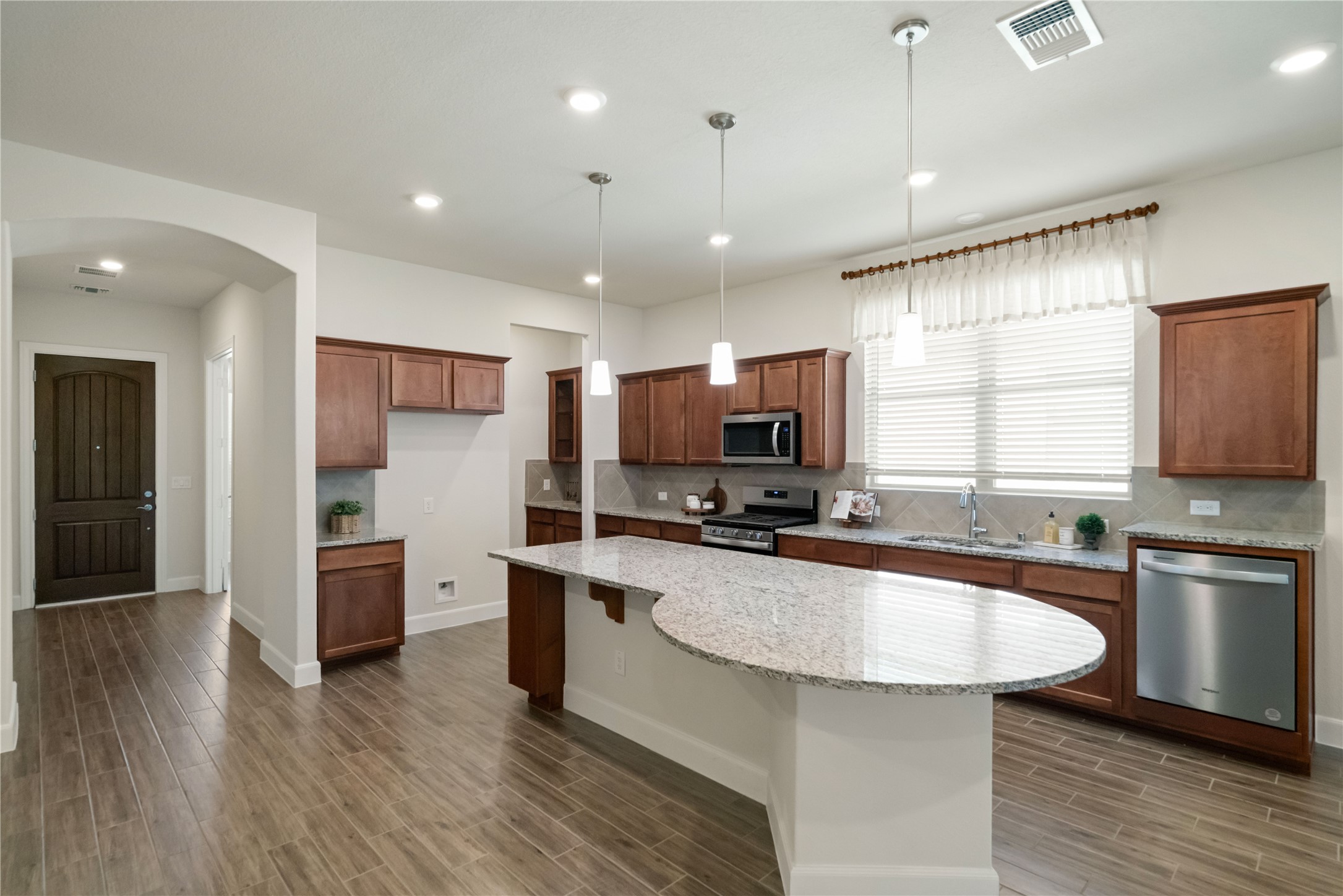 516 Nokota Drive Spring, TX 77382 - Photo 4 of 33 Another view of the open kitchen with butler's pantry in the far top right corner and walk-in pantry.