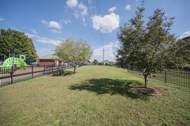swimming pool view with a garden