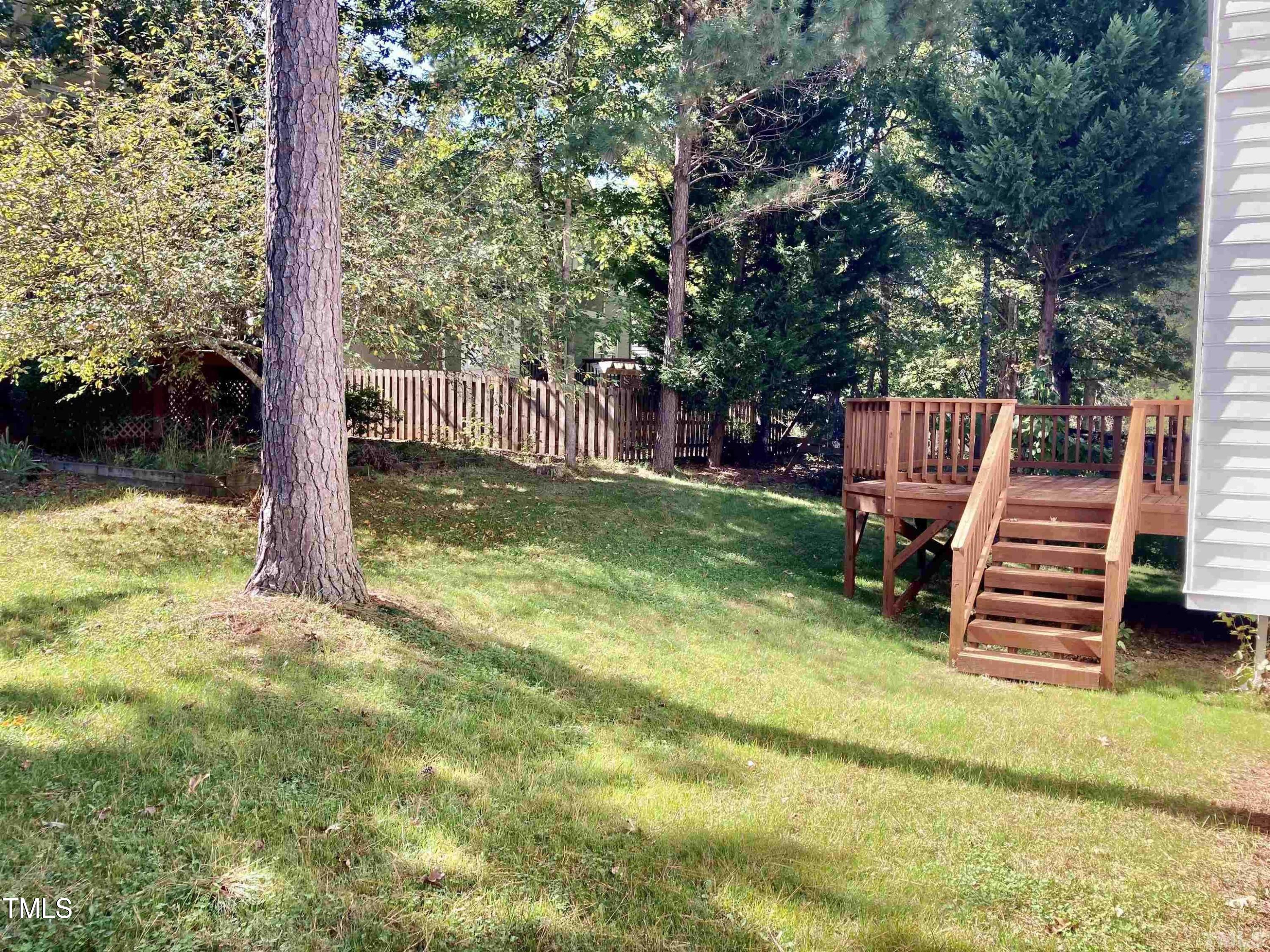 117 Mint Hill Drive Cary, NC 27519 - Photo 14 of 14 a view of a wooden deck with a big yard
