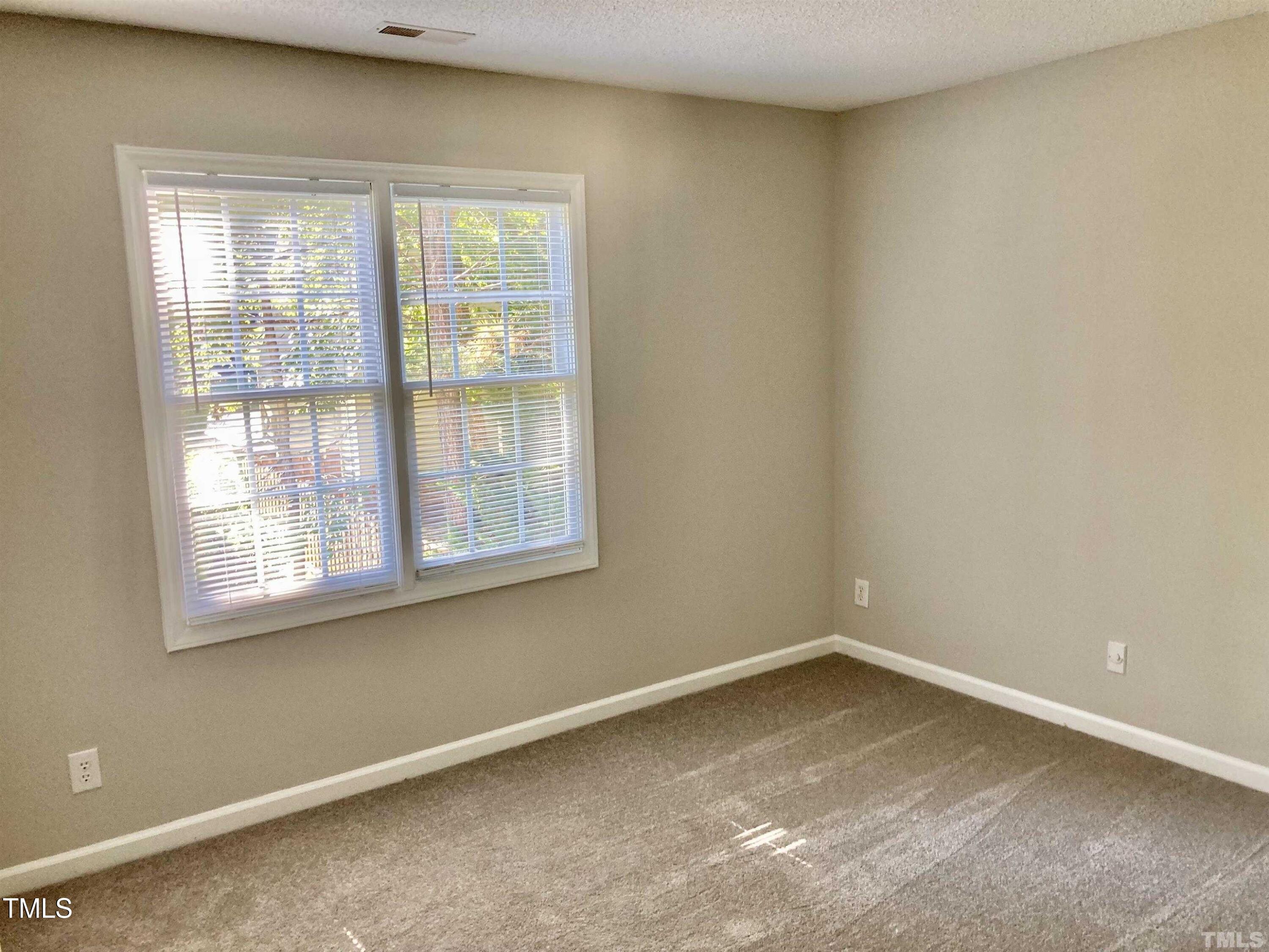 117 Mint Hill Drive Cary, NC 27519 - Photo 8 of 14 an empty room with a window