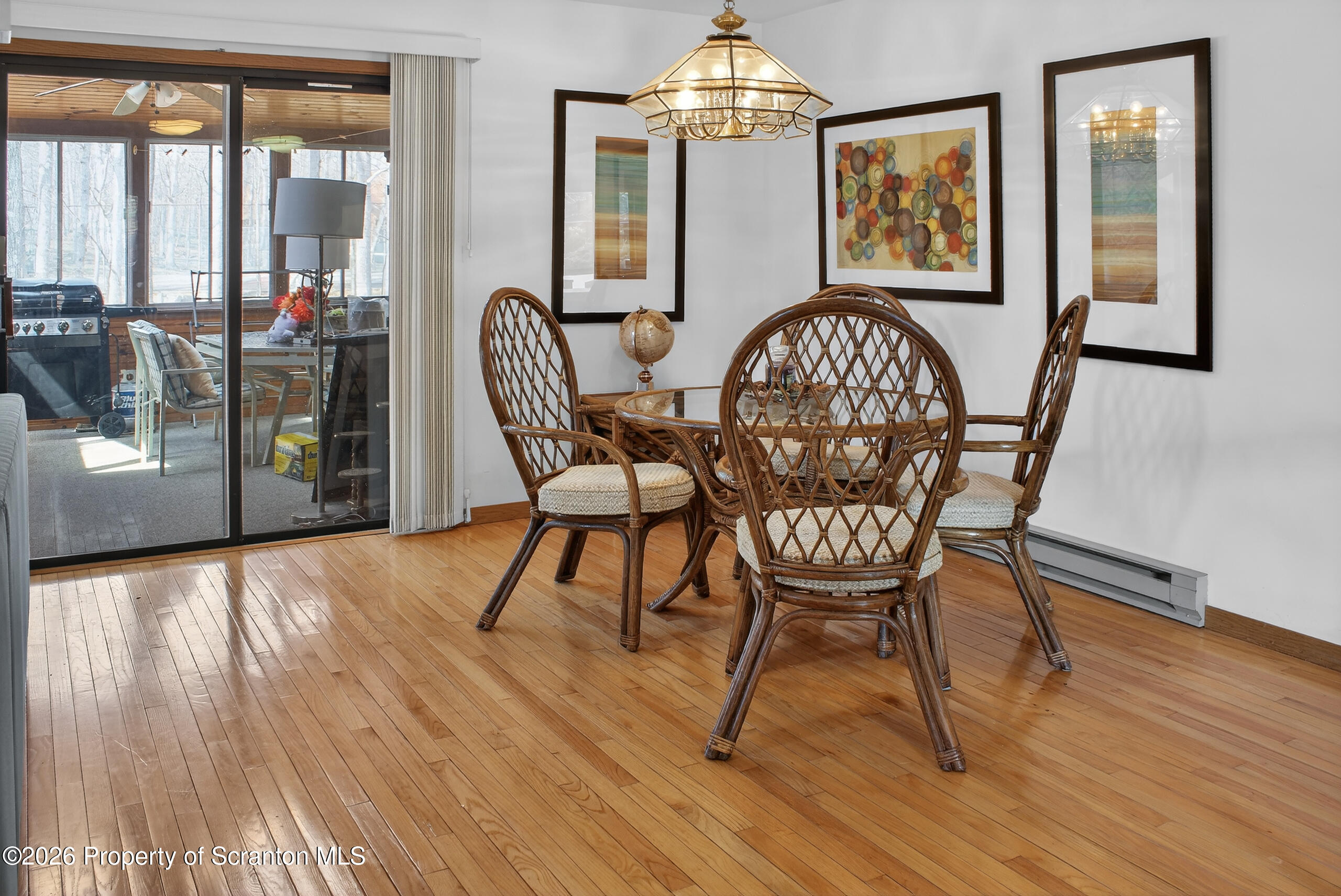 211 Falls Circle Bushkill, PA 18324 - Photo 7 of 28 a view of a dining room with furniture window and wooden floor