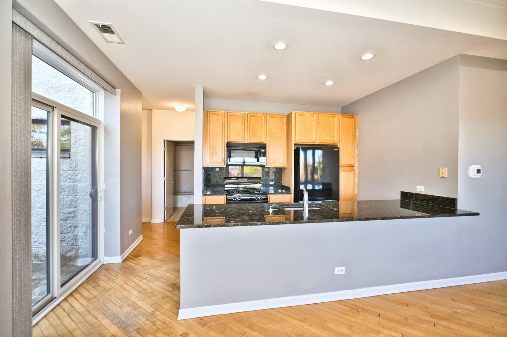 2317 West Wolfram Street, Unit 515 Chicago, IL 60618 - Photo 16 of 35 a view of a living room and kitchen