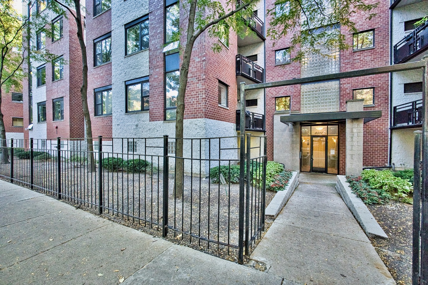 2317 West Wolfram Street, Unit 515 Chicago, IL 60618 - Photo 2 of 35 a view of a brick building with many windows