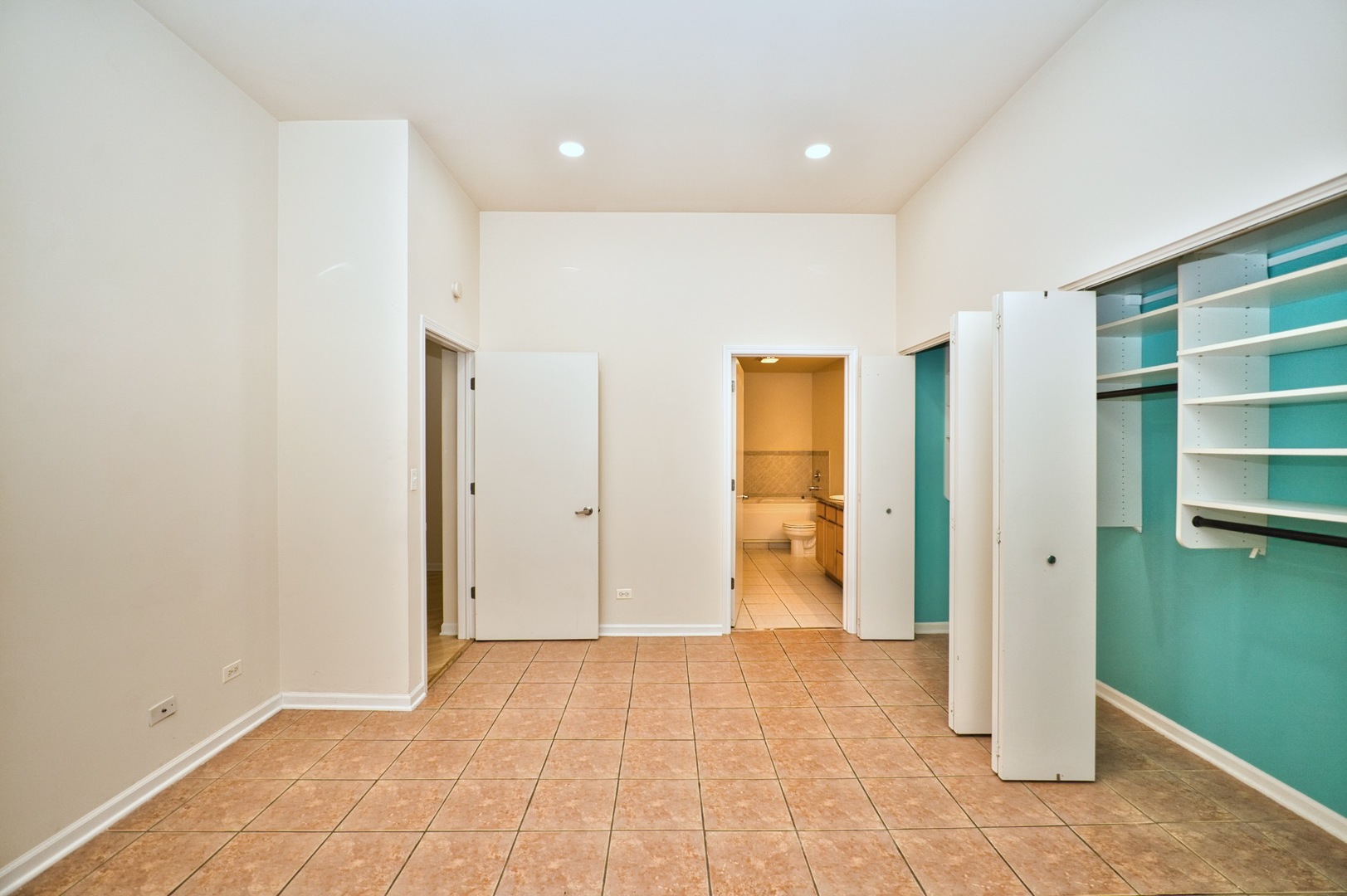 2317 West Wolfram Street, Unit 515 Chicago, IL 60618 - Photo 22 of 35 a view of an empty room with closet and empty shelves