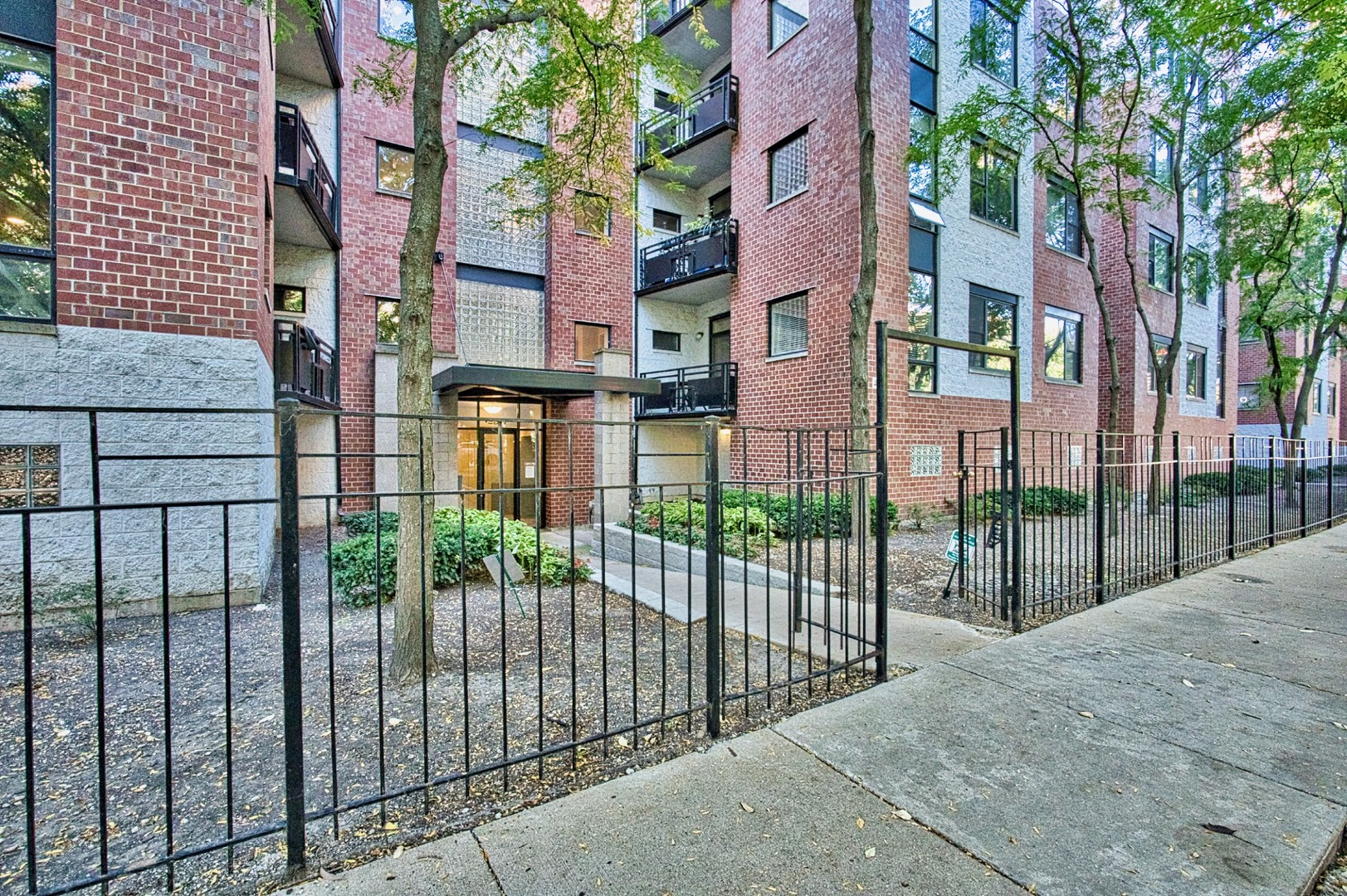 2317 West Wolfram Street, Unit 515 Chicago, IL 60618 - Photo 32 of 35 a view of a brick building from a balcony